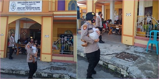 Polwan Ini Amankan Misa Natal Sambil Gendong Bayi